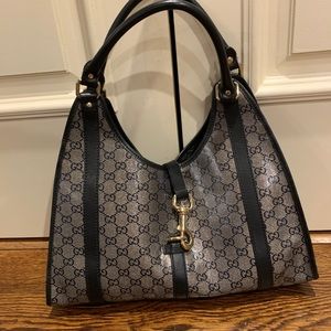 Gucci handbag in great condition. Silver and black with hint of gold